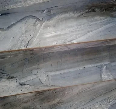 Layered stone textures in cool gray tones highlight abstract nature backgrounds Stock Photos