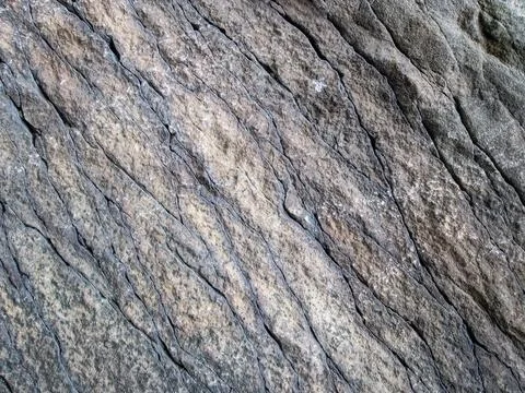 Layered texture of old stone. Shabby long-term stone. Ribbed texture with cracks Stock Illustration