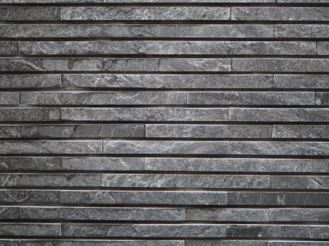 Layered thin grey stone brick background photograph. Stock Photos
