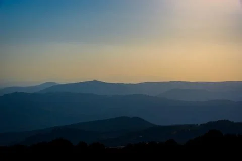 Layers of hills at sunset Stock Photos