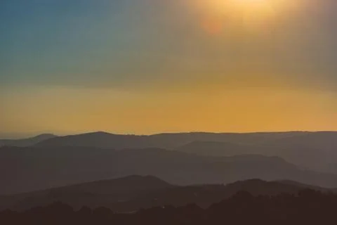 Layers of hills at sunset Stock Photos