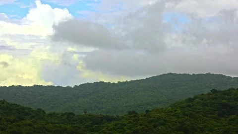 Layers of Mountain with layers of moving clouds Stock Footage 157380569