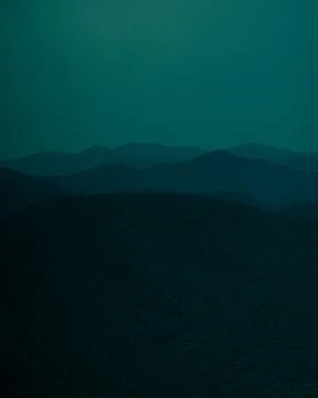 Layers of multiple landscapes during blue hour in nature Stock Photos