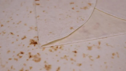 Layers of pita bread rotating slowly on table Stock Footage 106764118