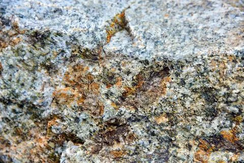 Layers of rocks. An interesting background with a mesmerizing marble texture Stock Photos
