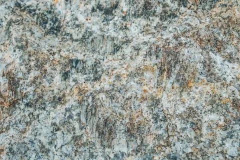 Layers of rocks. An interesting background with a mesmerizing marble texture Stock Photos