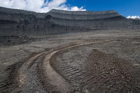 Layers of rough coal in the open pit mine Stock Photos