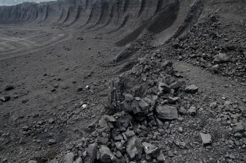 Layers of rough soft coal in the open pit mine Stock Photos