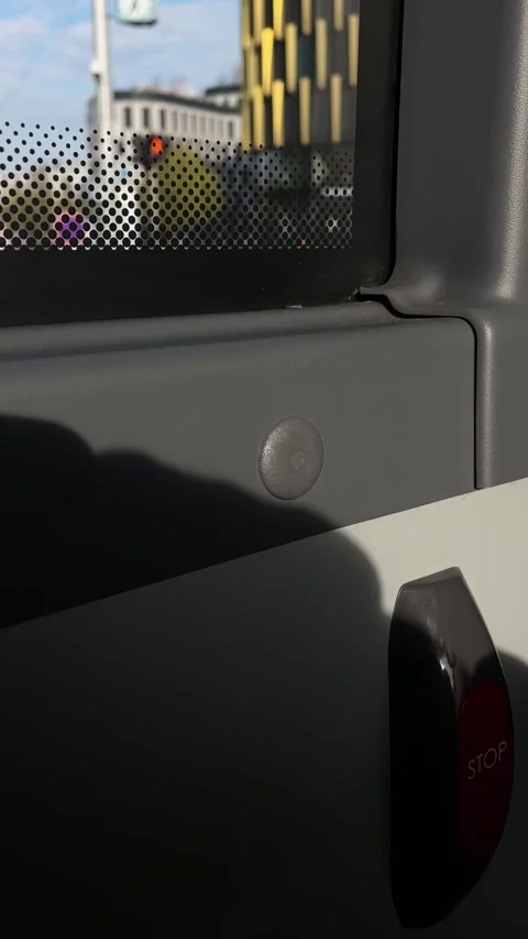Layers of shadows and reflections captured during city commute from bus window Stock Footage 335433508
