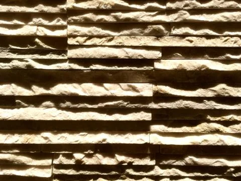 Layers of thin slate rock, uneven and jagged. Interior wall of granite of dif Stock Photos