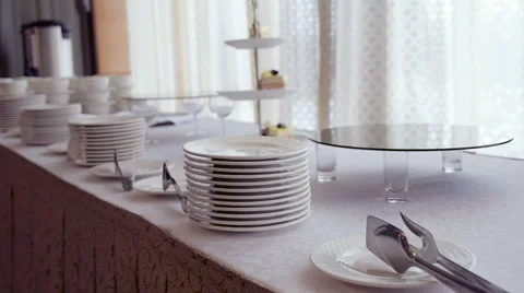 Laying and reserved dishes on table Stock Footage 58422178
