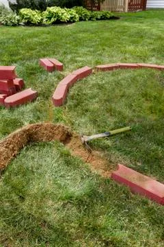 Laying brick edgers Stock Photos