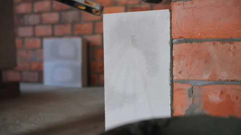 Laying a brick wall at a construction site Stock Footage 279910624