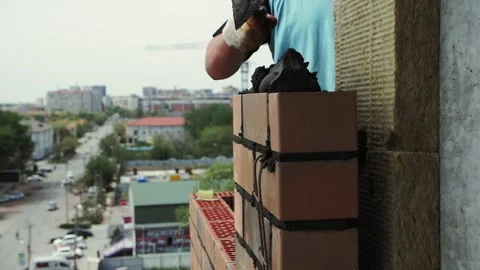 Laying bricks of the outer wall of the house Stock Footage 192474687