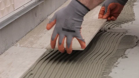 Laying ceramic tile closeup Stock Footage 111865266