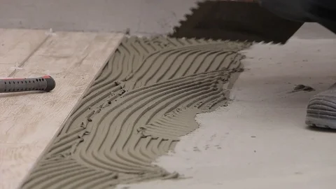 Laying ceramic tiles with cement adhesive Stock Footage 111865136