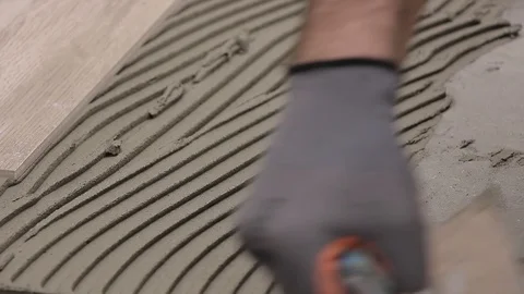 Laying ceramic tiles with cement adhesive Stock Footage 111865178