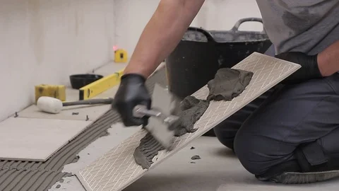 Laying ceramic tiles with cement adhesive Stock Footage 111866232