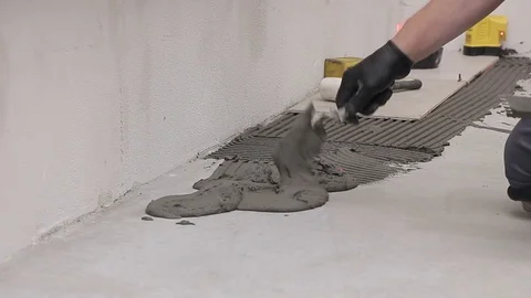 Laying ceramic tiles with cement adhesive Stock Footage 111866252