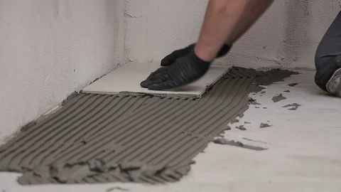 Laying ceramic tiles with cement adhesive Stock Footage 111866254