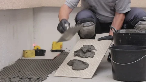 Laying ceramic tiles with cement adhesive Stock Footage 111866331