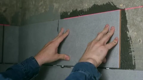 Laying Ceramic Tiles. Stock Footage 244369613