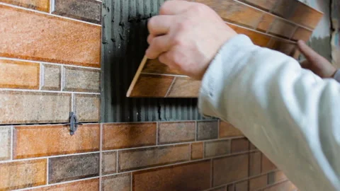 Laying ceramic tiles in the kitchen Stock Footage 116565914
