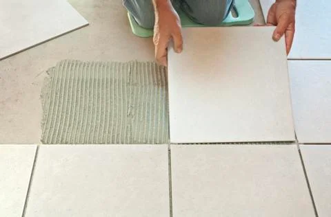Laying ceramic tiles Stock Photos