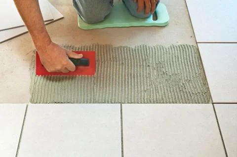 Laying ceramic tiles Stock Photos