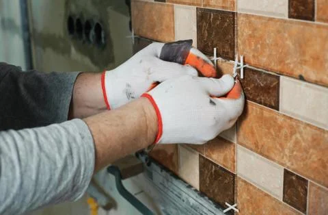Laying Ceramic Tiles. Stock Photos