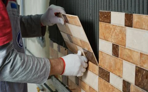 Laying Ceramic Tiles. Stock Photos