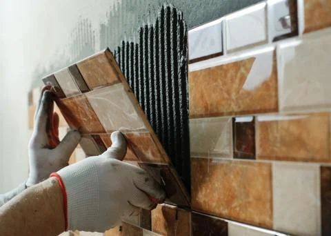 Laying Ceramic Tiles. Stock Photos