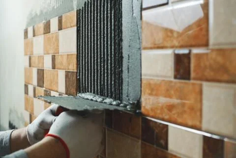 Laying Ceramic Tiles. Stock Photos