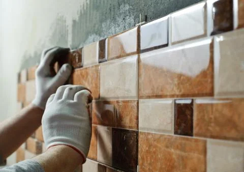 Laying Ceramic Tiles. Stock Photos