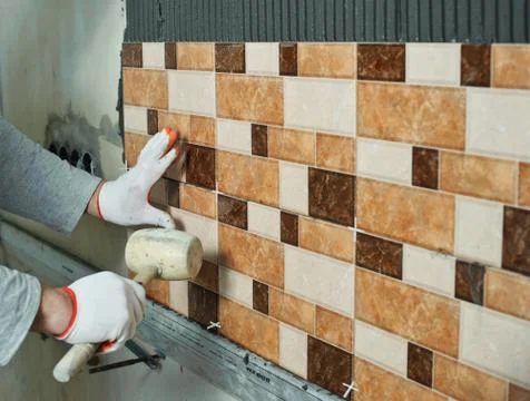 Laying Ceramic Tiles. Stock Photos