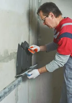 Laying Ceramic Tiles. Stock Photos