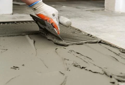 Laying Ceramic Tiles. Stock Photos