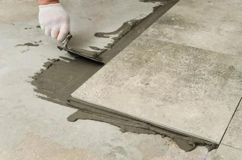 Laying Ceramic Tiles. Stock Photos