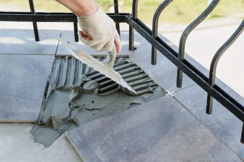 Laying Ceramic Tiles. Stock Photos