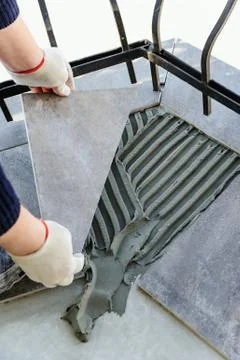 Laying Ceramic Tiles. Stock Photos