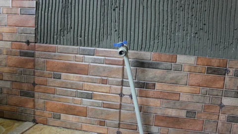 Laying Ceramic Tiles on the wall Stock-Footage 112661303