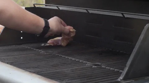 Laying Chicken on the Grill 스톡 동영상 38010291