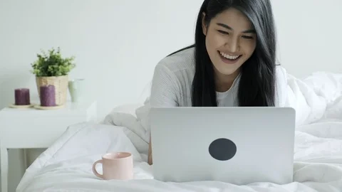 Laying down in my bed and working is so fun. Stock Footage 104070200