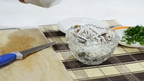 The laying of the eggs in a dish with salad Stock Footage 83293991