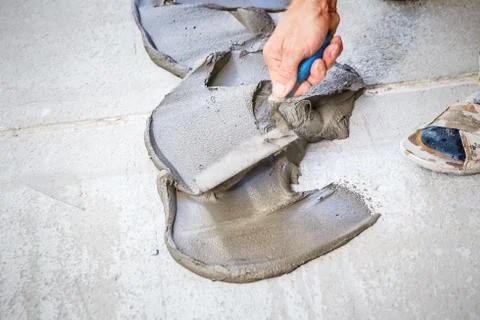 Laying floor ceramic tile Stock Photos