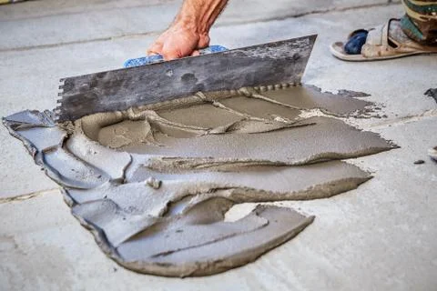 Laying floor ceramic tile Stock Photos