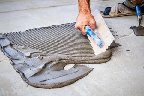 Laying floor ceramic tile Stock Photos
