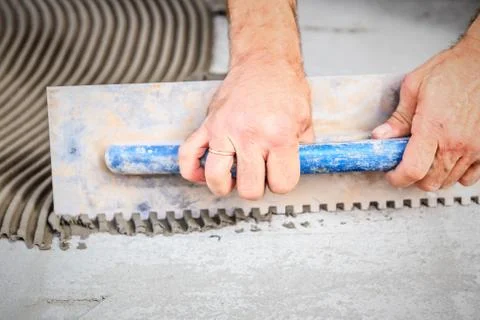Laying floor ceramic tile Stock Photos