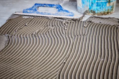 Laying floor ceramic tile Stock Photos