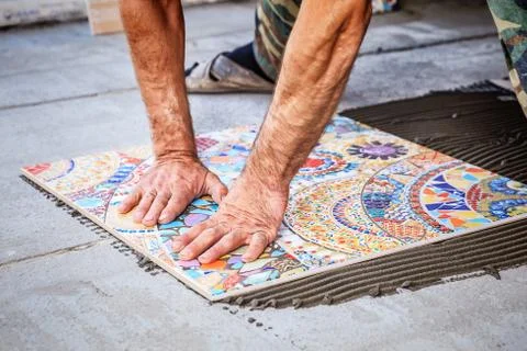 Laying floor ceramic tile Stock Photos